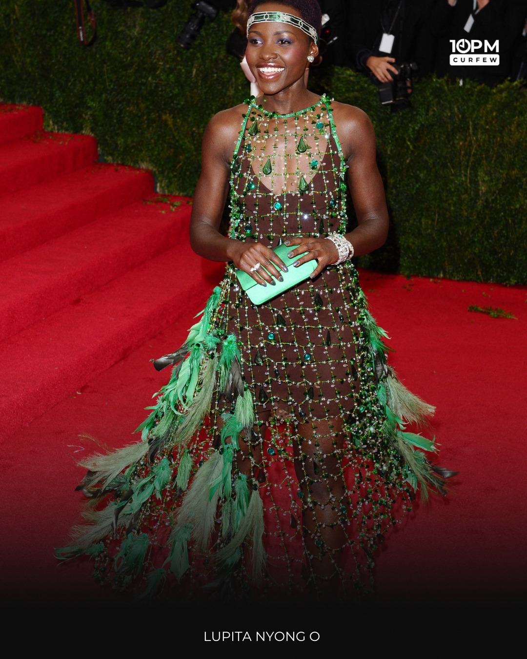 Green goddess. Lupita Nyong'o dazzles in a beaded forest fantasy gown, with feathers and flair that enchant the carpet. 🍃