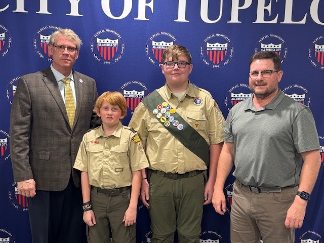 City - Boy Scouts Will Zahn (second from left) and Jake Greer (third ...
