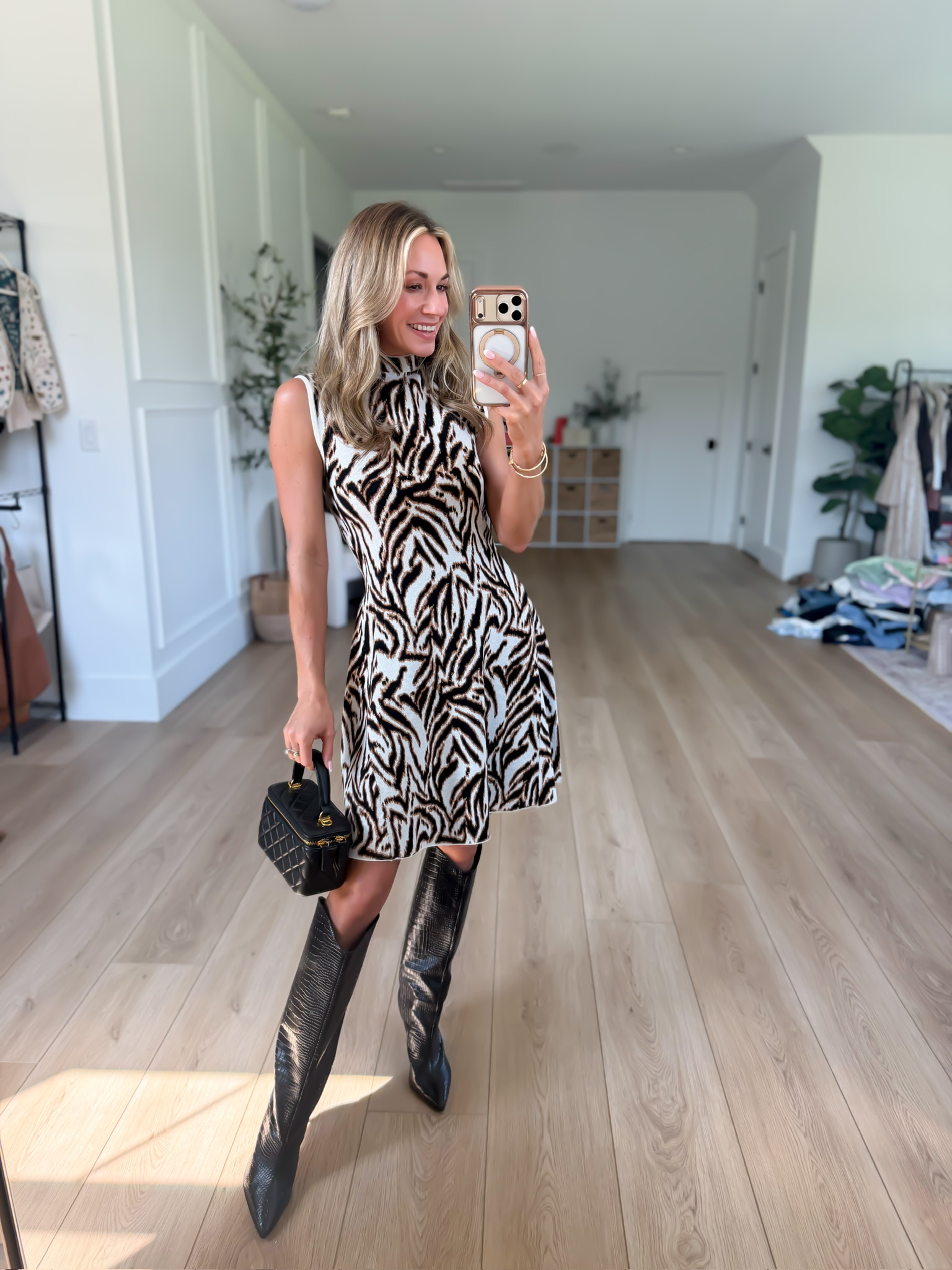 This zebra print mini dress is SUCH a fun fall find! I love it styled with tall black boots for an easy fall date night or girls' night outfit. https://liketk.it/6mV6H