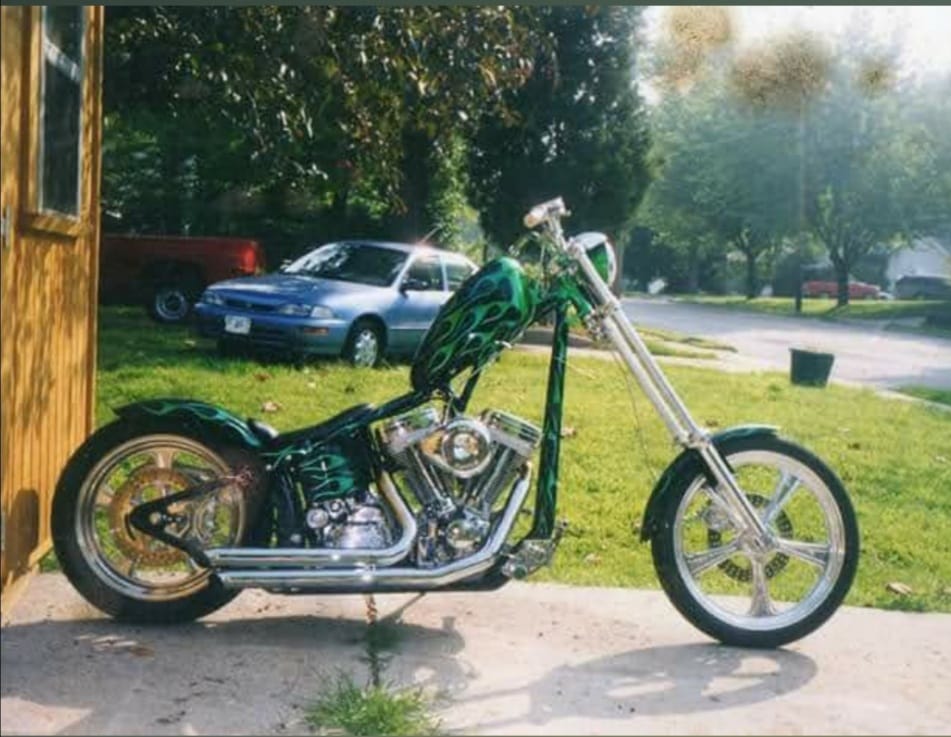 Custom Chopper Motorcycle with After-Market Parts and Unique Features