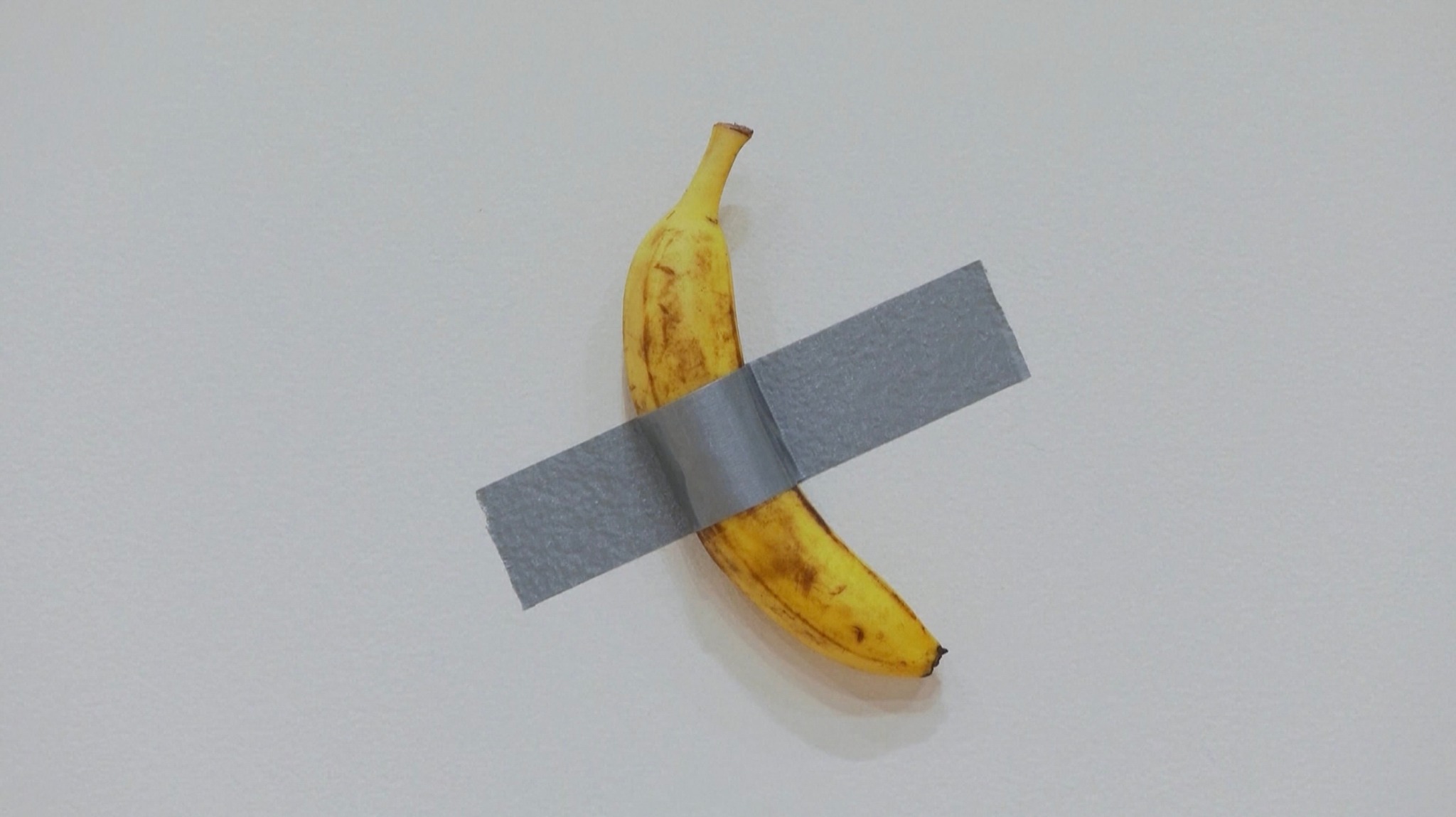 A banana duct-taped to a white wall sold at an auction for $6.24
