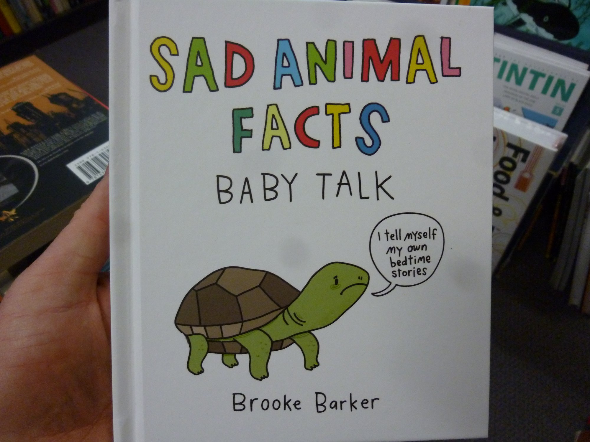 It's a book full of postcards with horrible newsand cute baby
