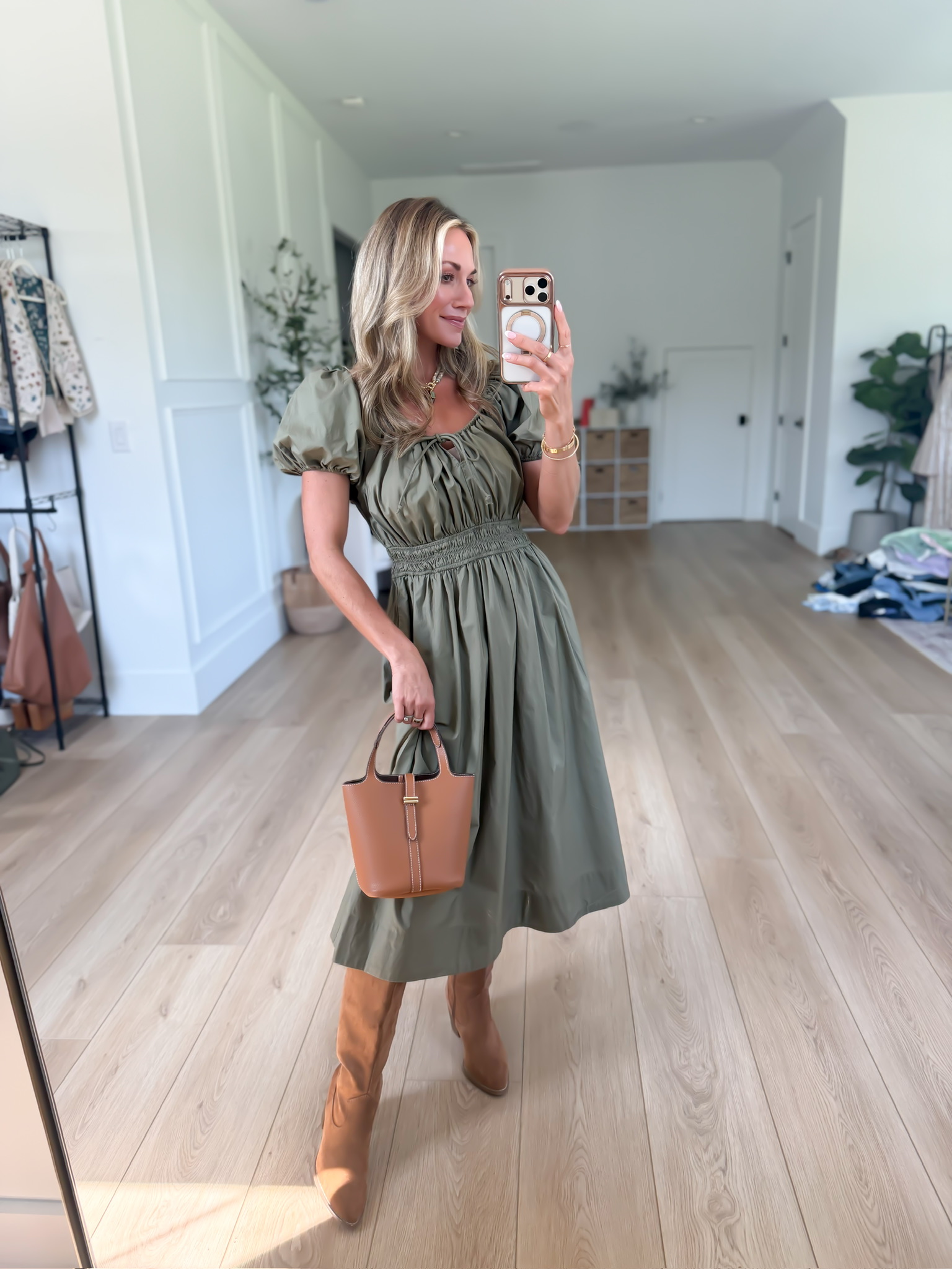 green dress brown boots The prettiest olive fall dress! I love the smocked waist and puff sleeves, and it looks SO good paired with and a little structured bag. https://liketk.it/6mV6H up collar with opening