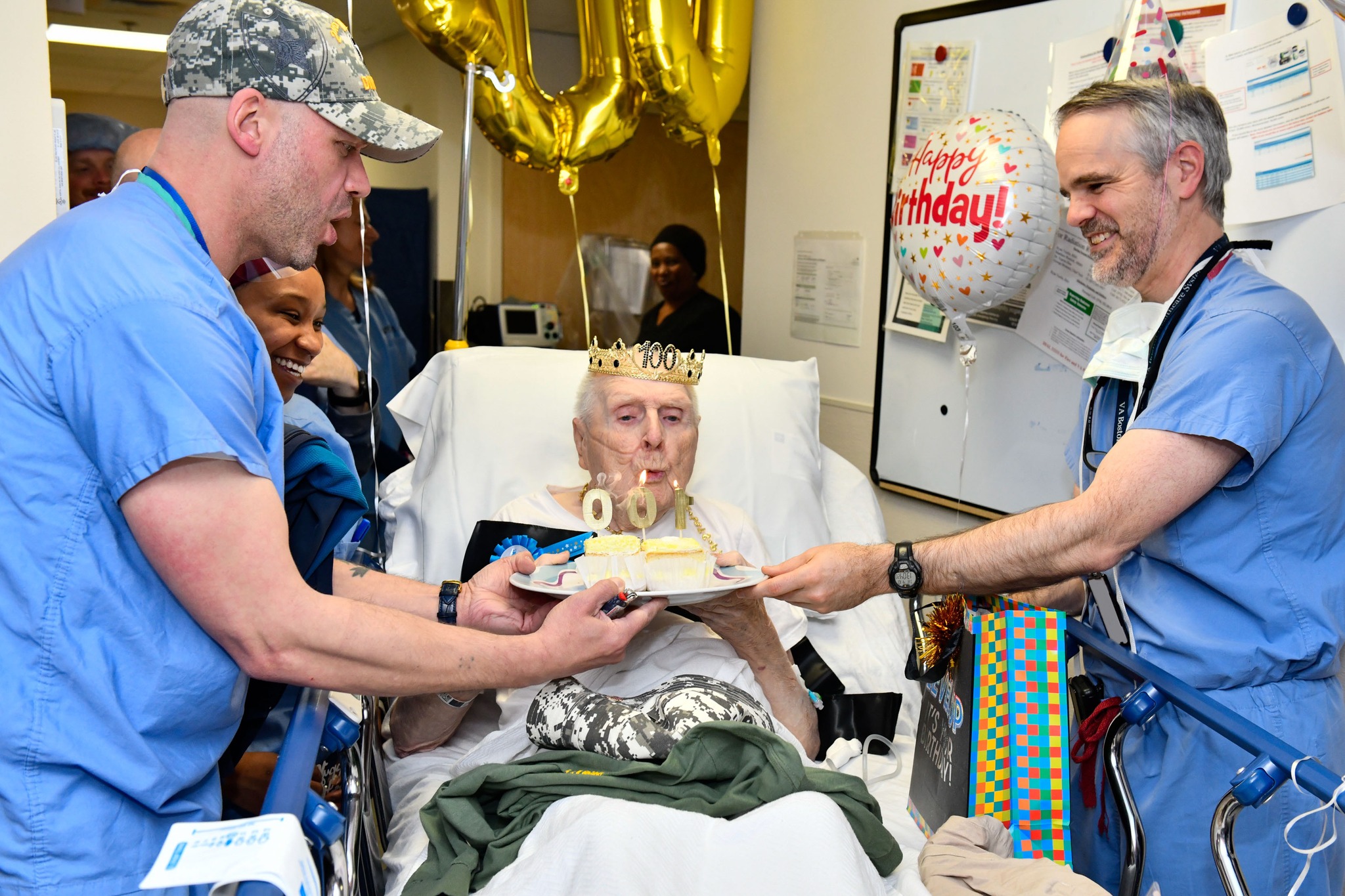 VA - Army Veteran James Hindle blows out the candles on his cake with ...