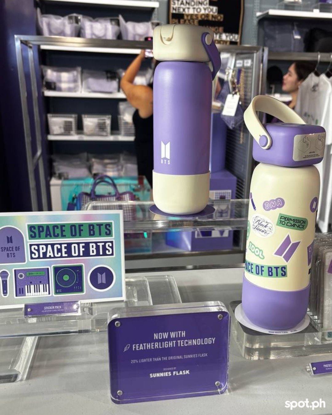 The limited-edition Space of BTS Robo Flasks in purple and white