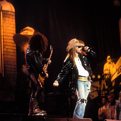 Guns N' Roses performing at Farm Aid, 1990. Photo by Ebet Roberts.