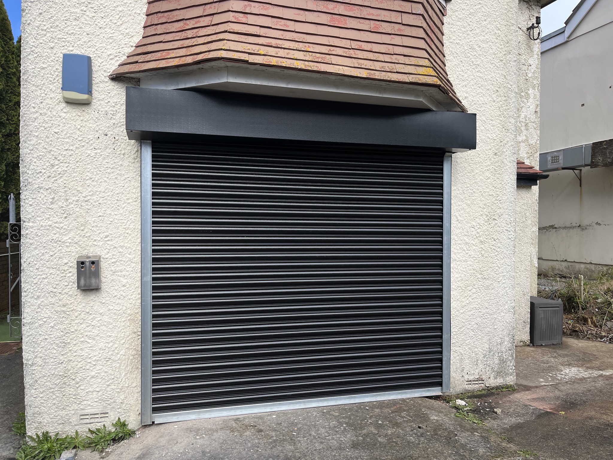 SJD - The lovely black steel roller shutter is a perfect blend of ...
