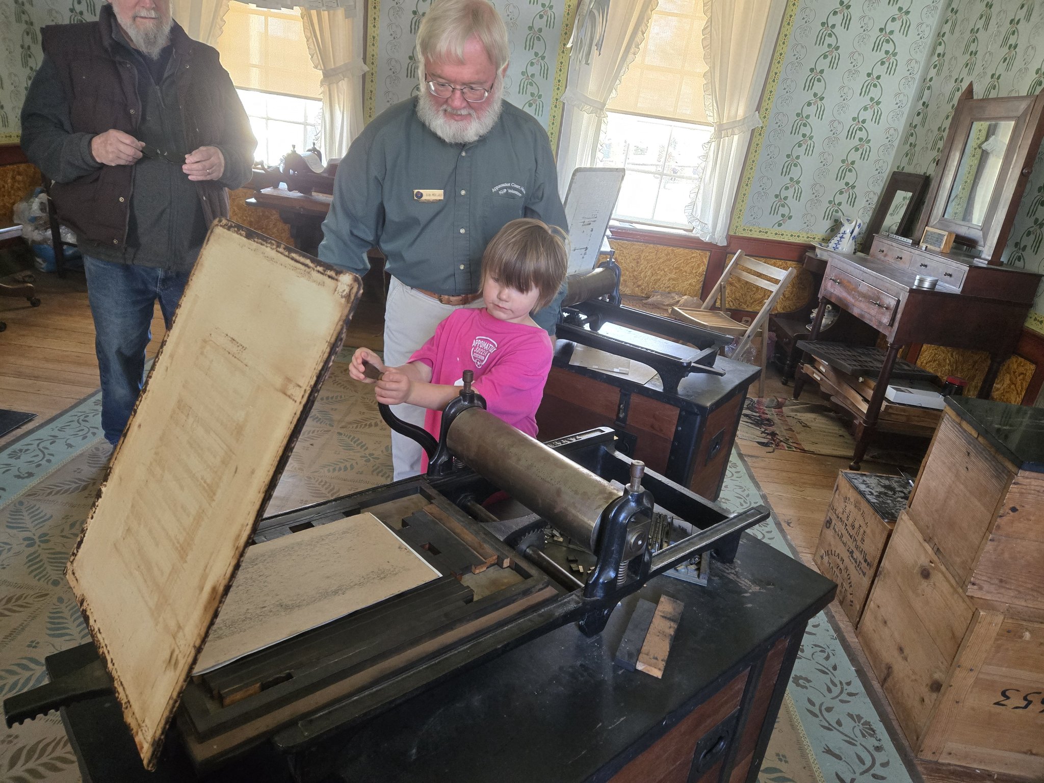 Appomattox - Volunteer helps a young visitor turn the handle on a ...
