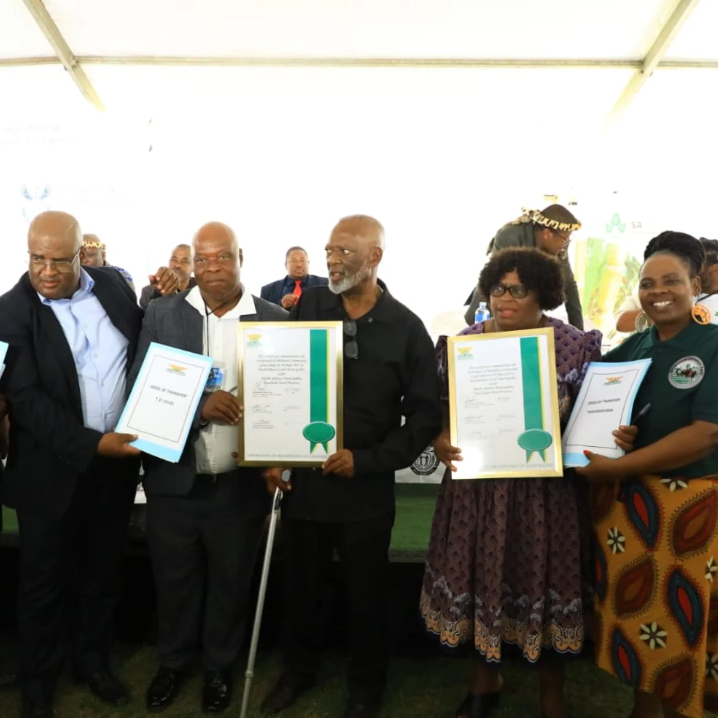 Department - Members of the Mathonsi Community receiving the title deed ...