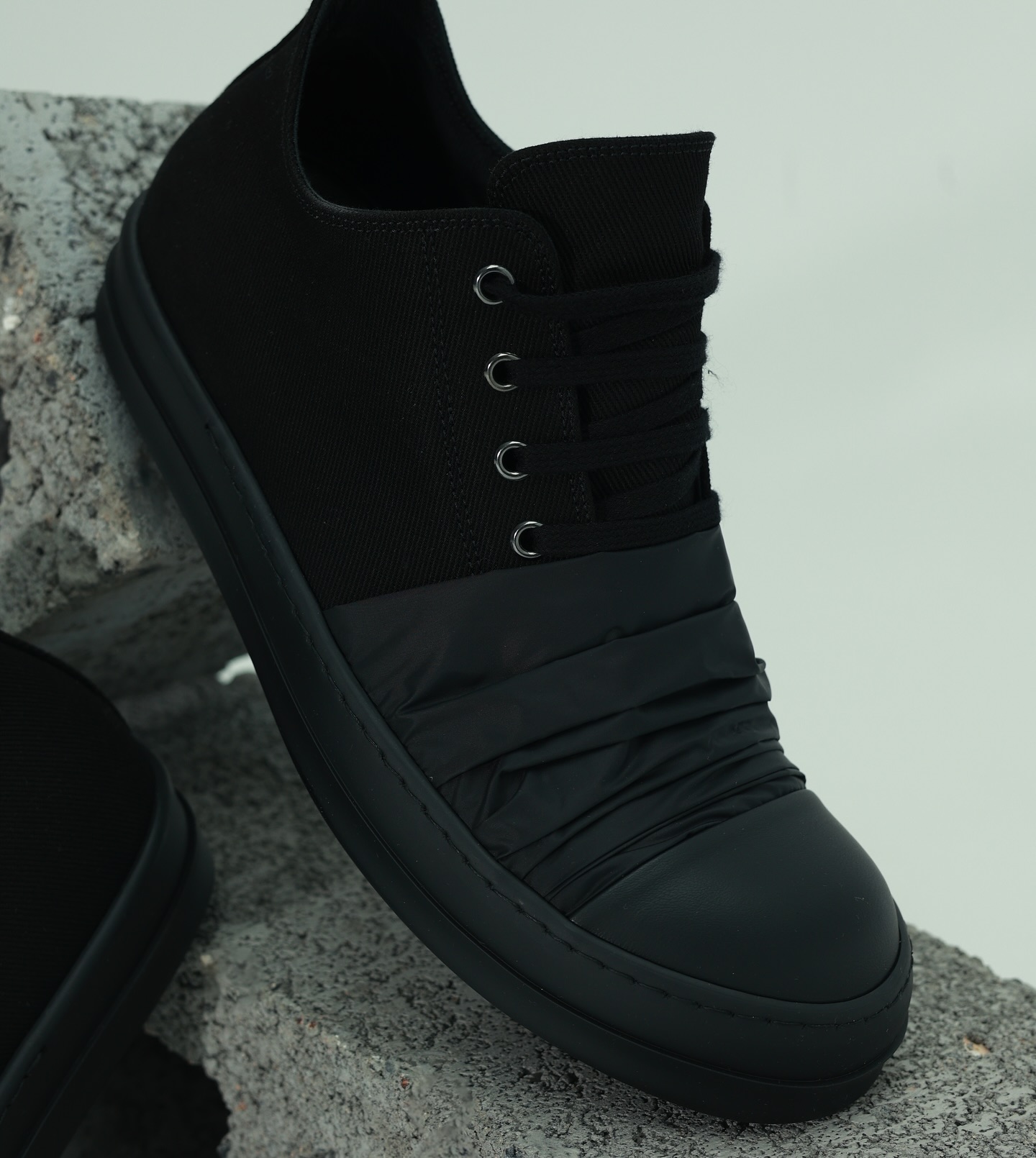 Not your average black sneaker ,structured, minimal, and 