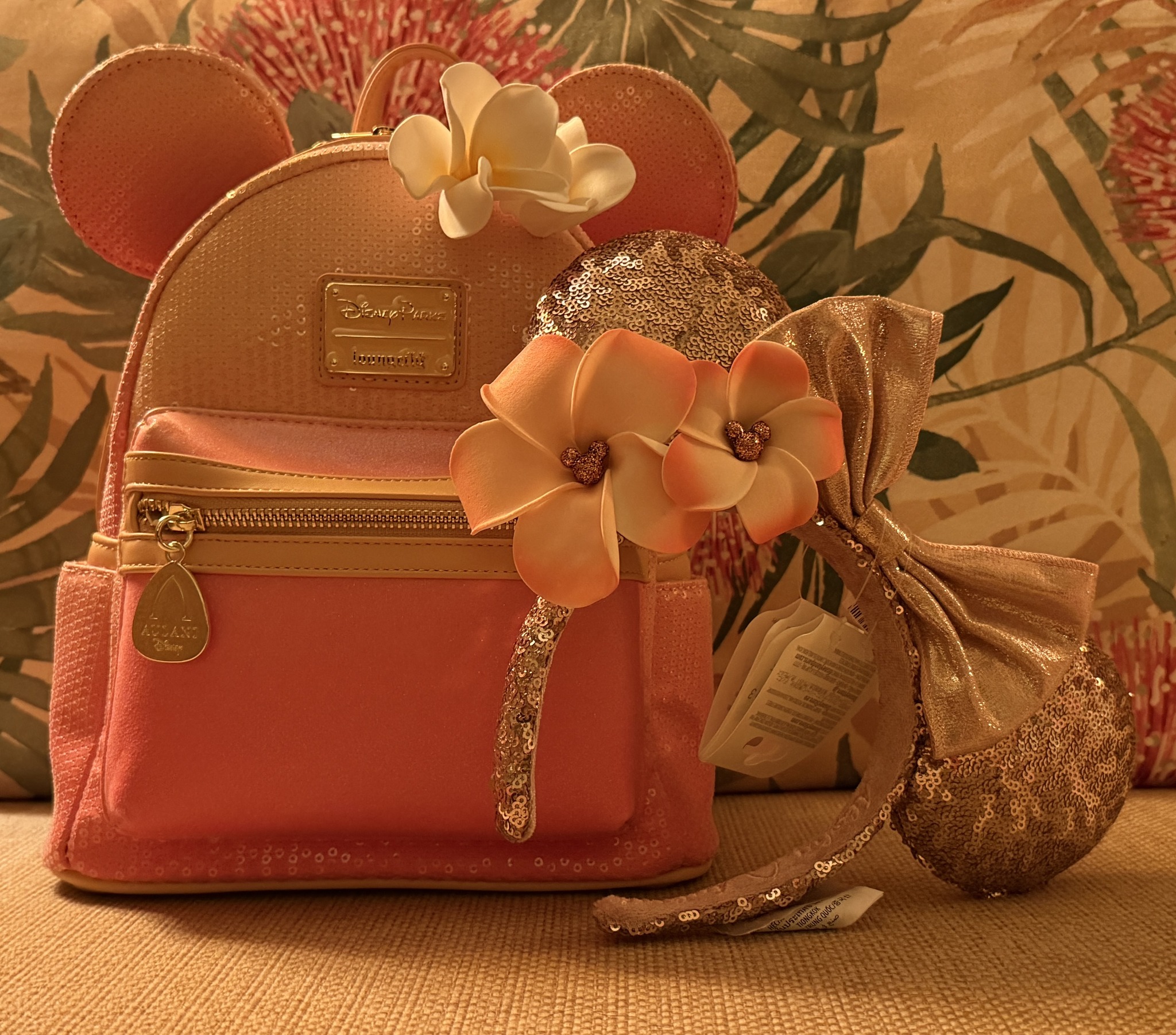aulani loungefly mini backpack Disney Resort Mickey Minnie Fire Pit embroidered and printed details with a coordinating interior lining Disney Parks Loungefly Aulani ‘Olu