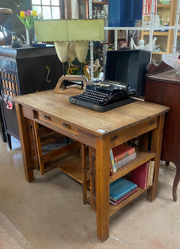 1950s-inspired office desk with vintage typewriter and accessories