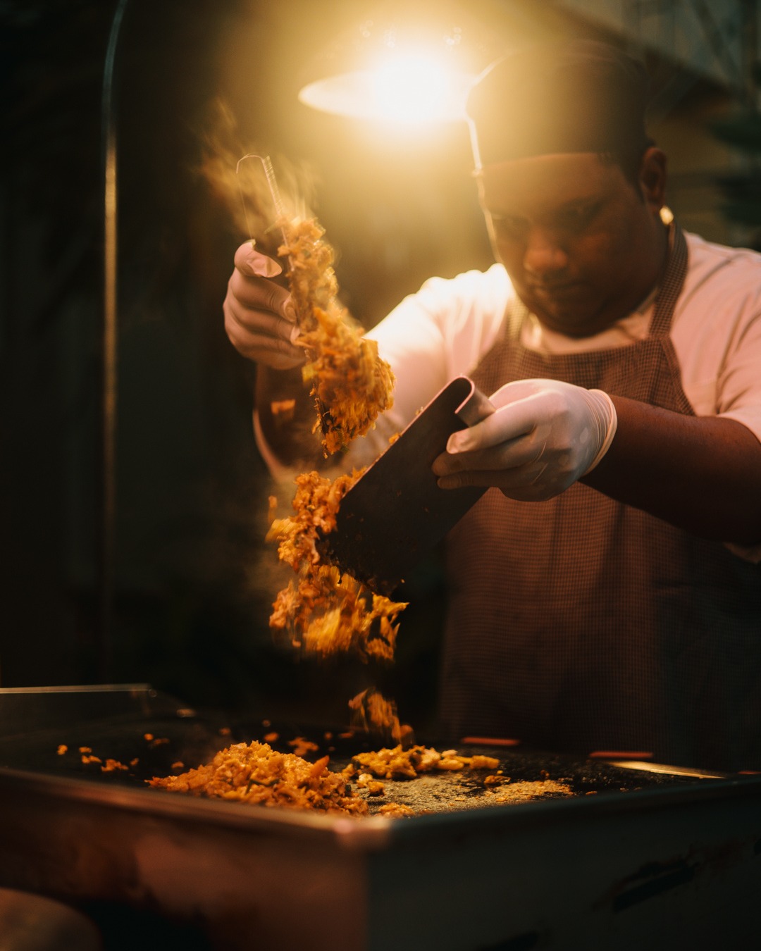 Heritance - Hear the rhythmic clatter of cleavers hitting the griddle ...