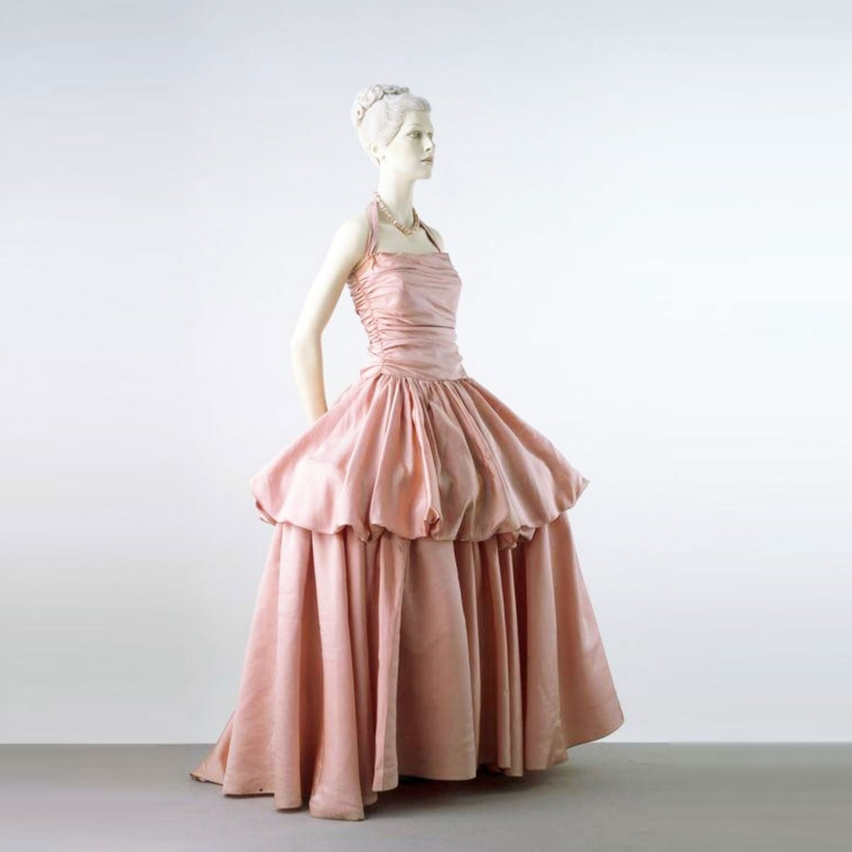British Musical Comedy star Gertrude Lawrence in a satin evening dress by Molyneux with diamond shaped panels. 1931 Molyneux was a leading British fashion designer whose salon in Paris was in operation