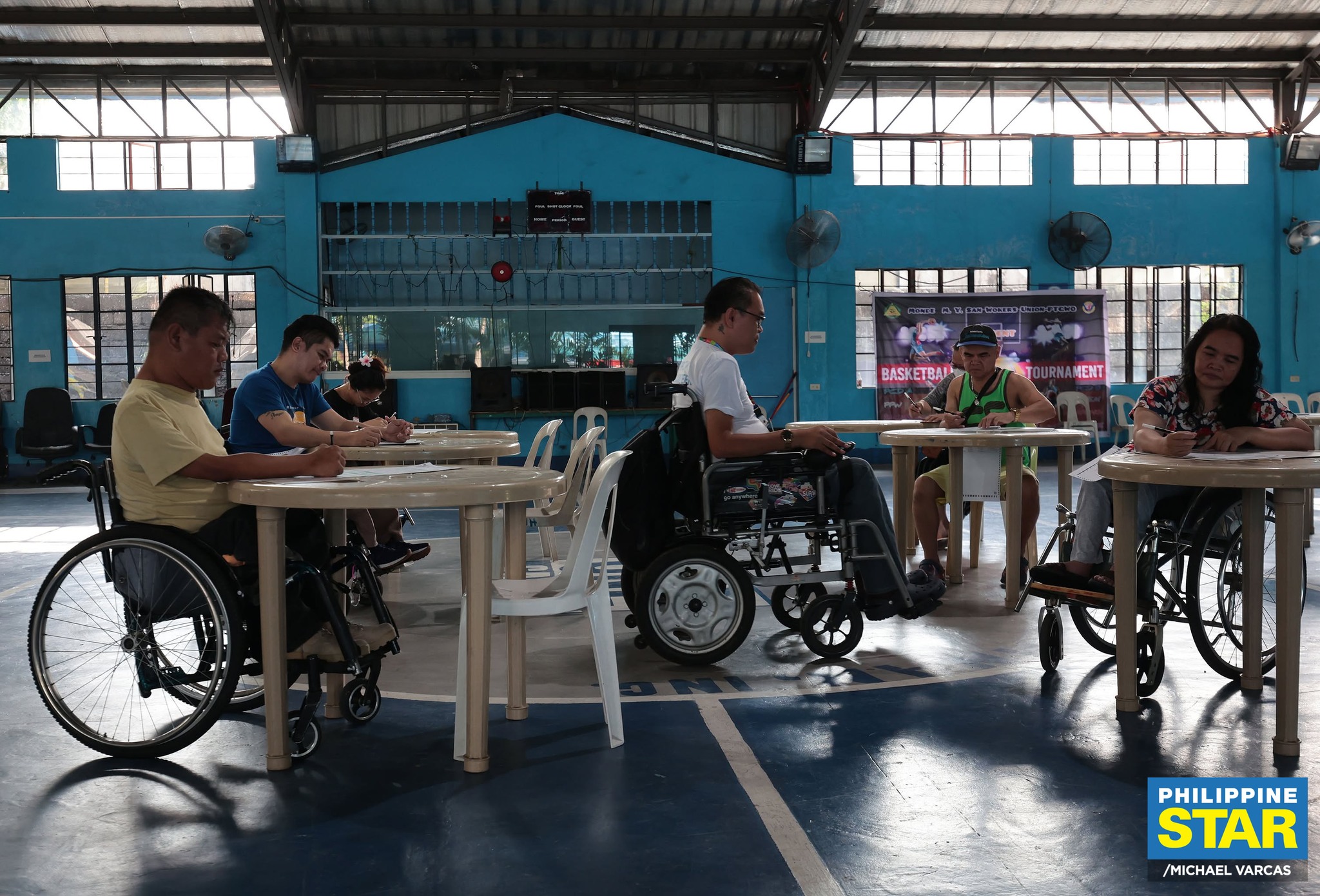 Philippine - Persons with disabilities (PWDs) line up to vote at ...