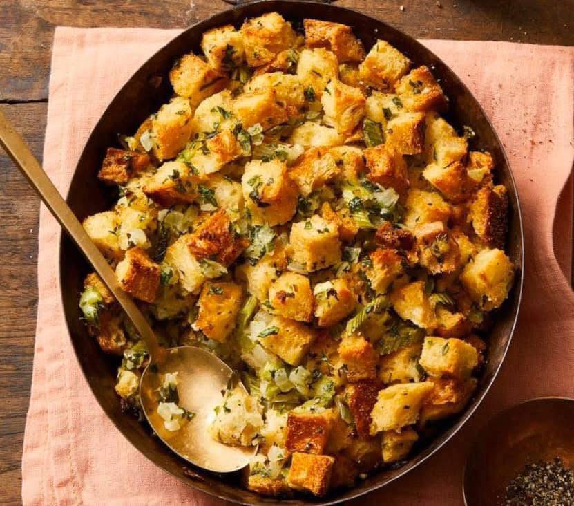 TRADITIONAL SAGE DRESSING (Serves 10) 3/4 cup (1 1/2 sticks) unsalted butter plus more for baking dish 1 pound good-quality day-old white bread, torn into 1