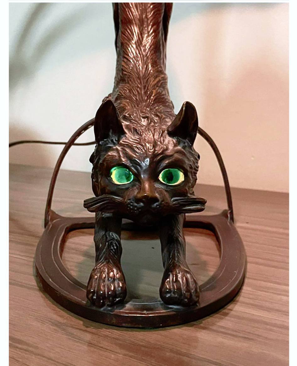 Vintage bronze cat lamp with glowing eyes from Austria
