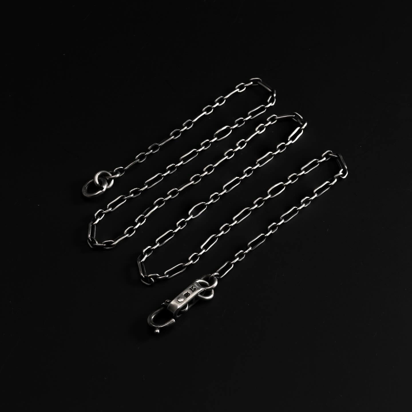 The Werkstatt München Sterling Silver Squeezed Link necklaces with 