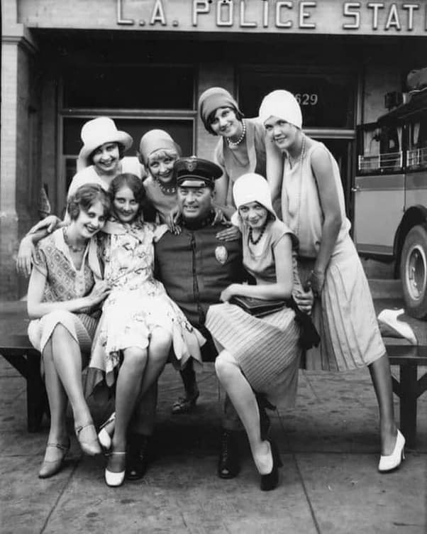 Los Angeles policeman with 1920s flappers