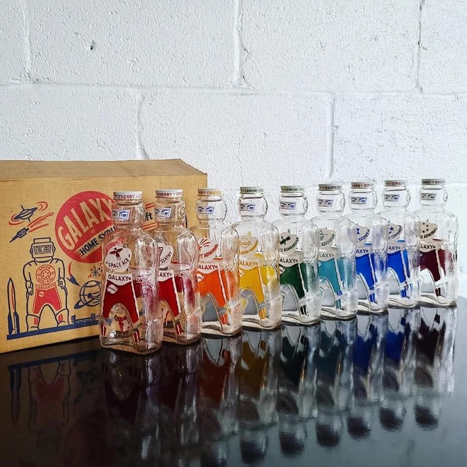 Vintage 1953 Galaxy Spaceman soda syrup bottles