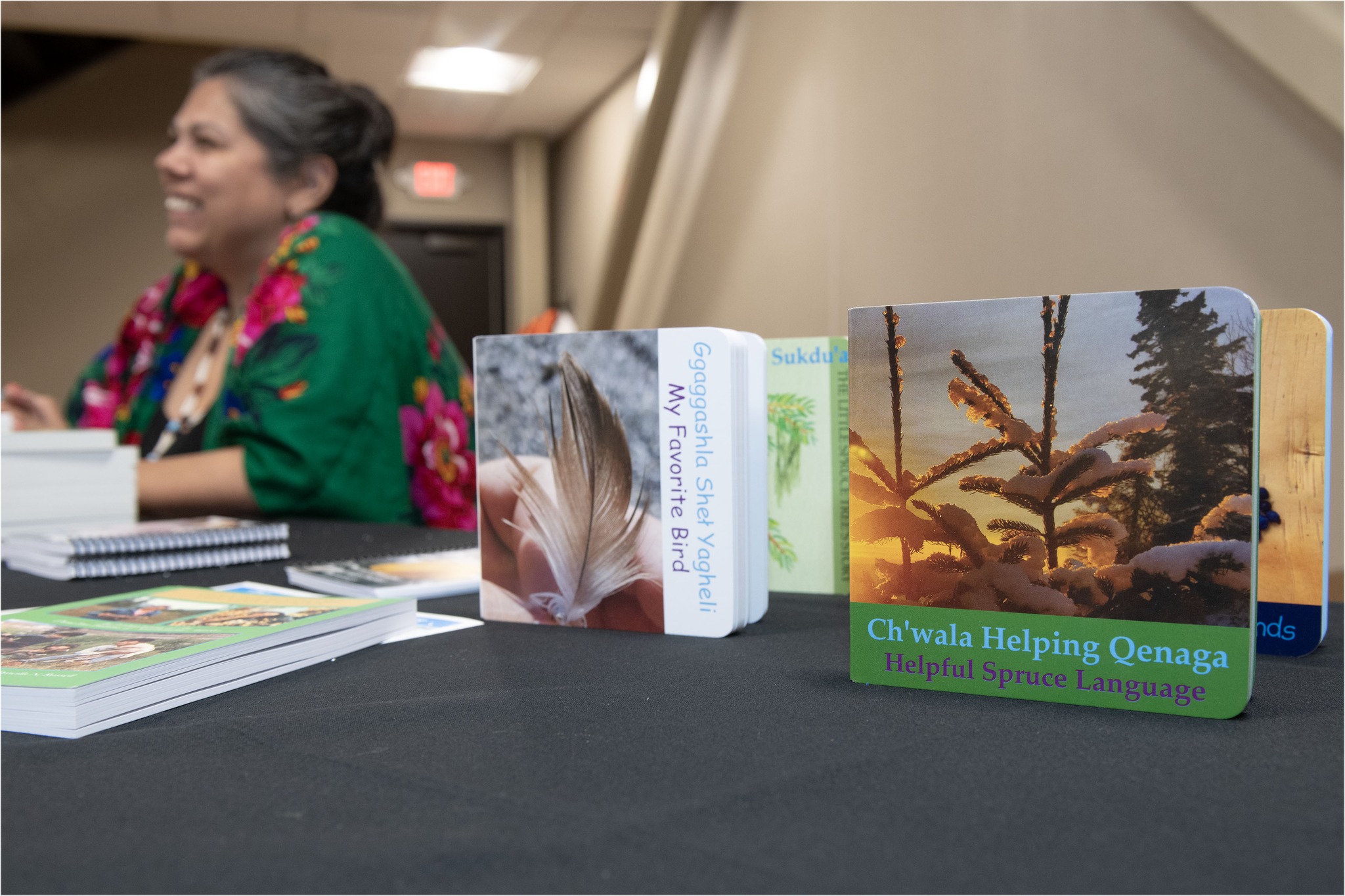 Kenaitze - Jennifer Williams speaks with a visitor while helping to ...