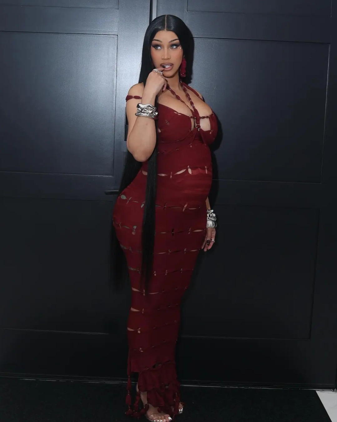 Cardi B celebrated her 33rd birthday in a custom burgundy bandage dress that hugged her growing baby bump. ❤️ 📸: Instagram/Cardi B