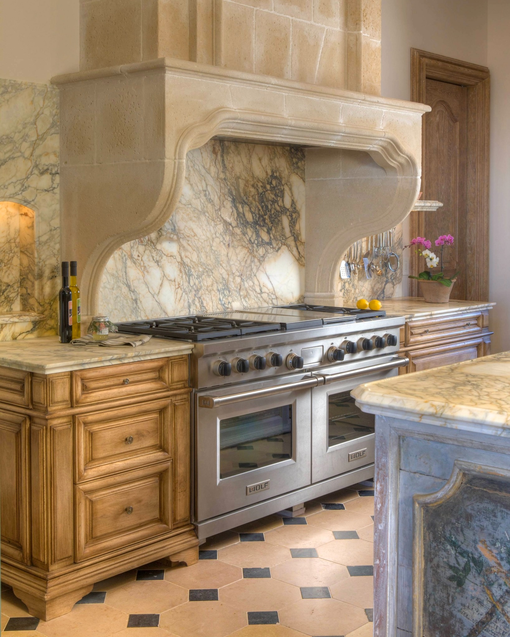 Compas - A French limestone range vent eliminates visual breaks ...