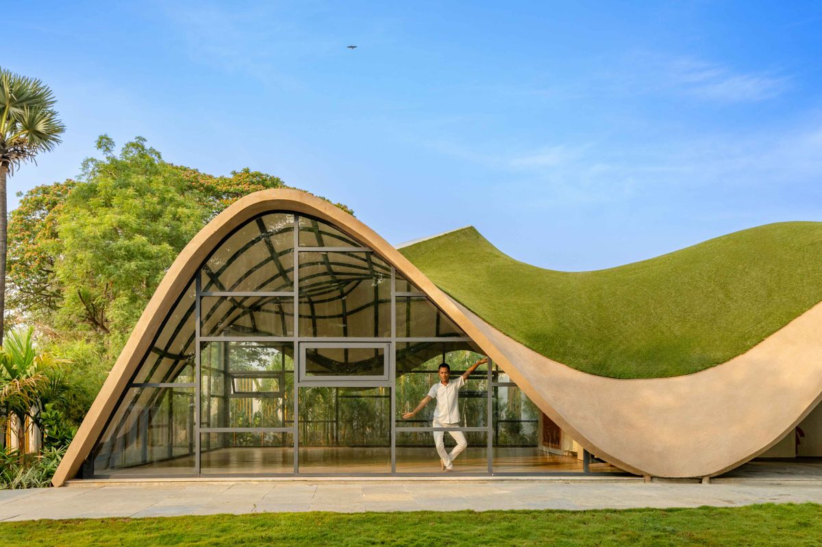 Architizer - Full-height glass, a curving turfed roof and... | Facebook