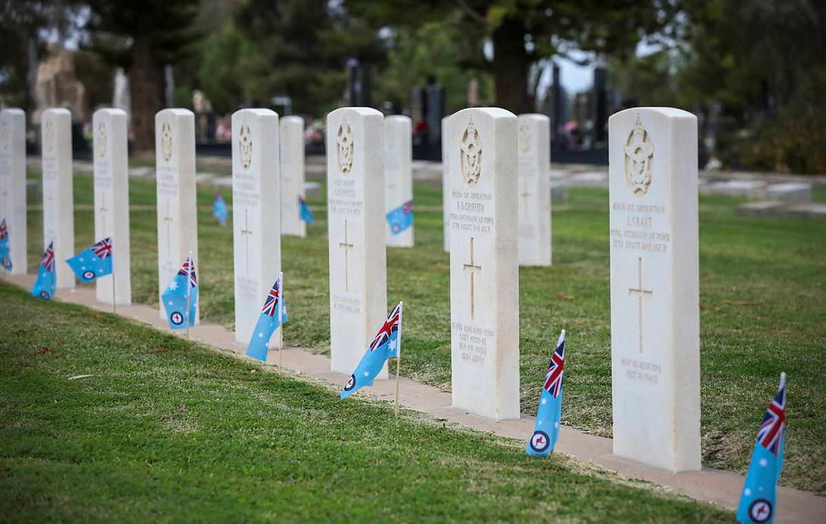 Air - RAAF ensigns emplaced at the base of the war graves of RAAF ...