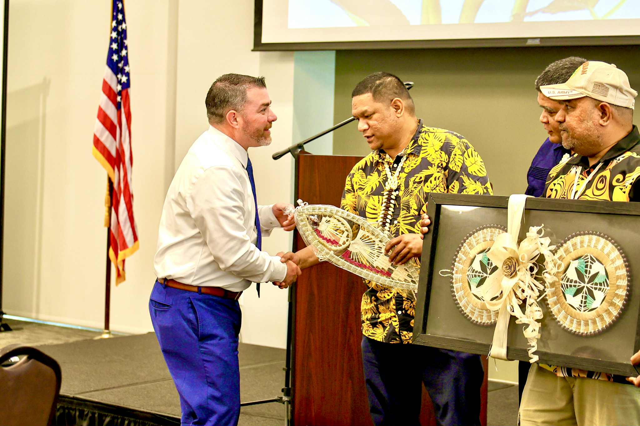 RMI - RMI SBDC Director Dustin Hiram Langidrik presents token of ...