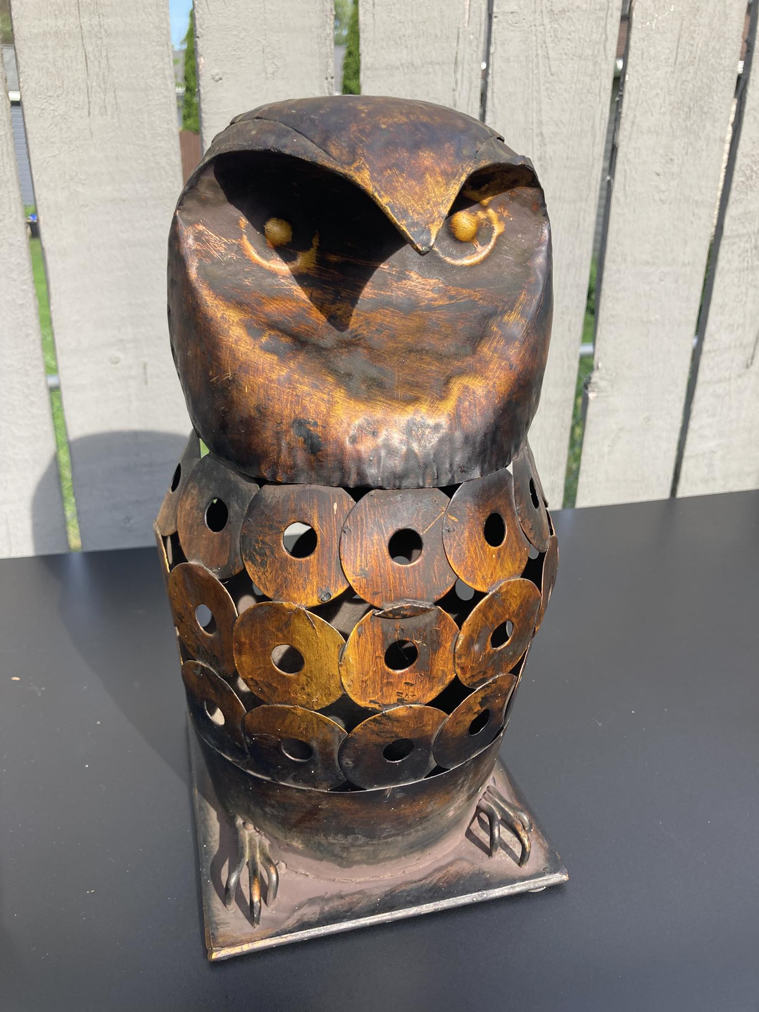 Mothman-inspired metal owl sculpture with wooden base found at