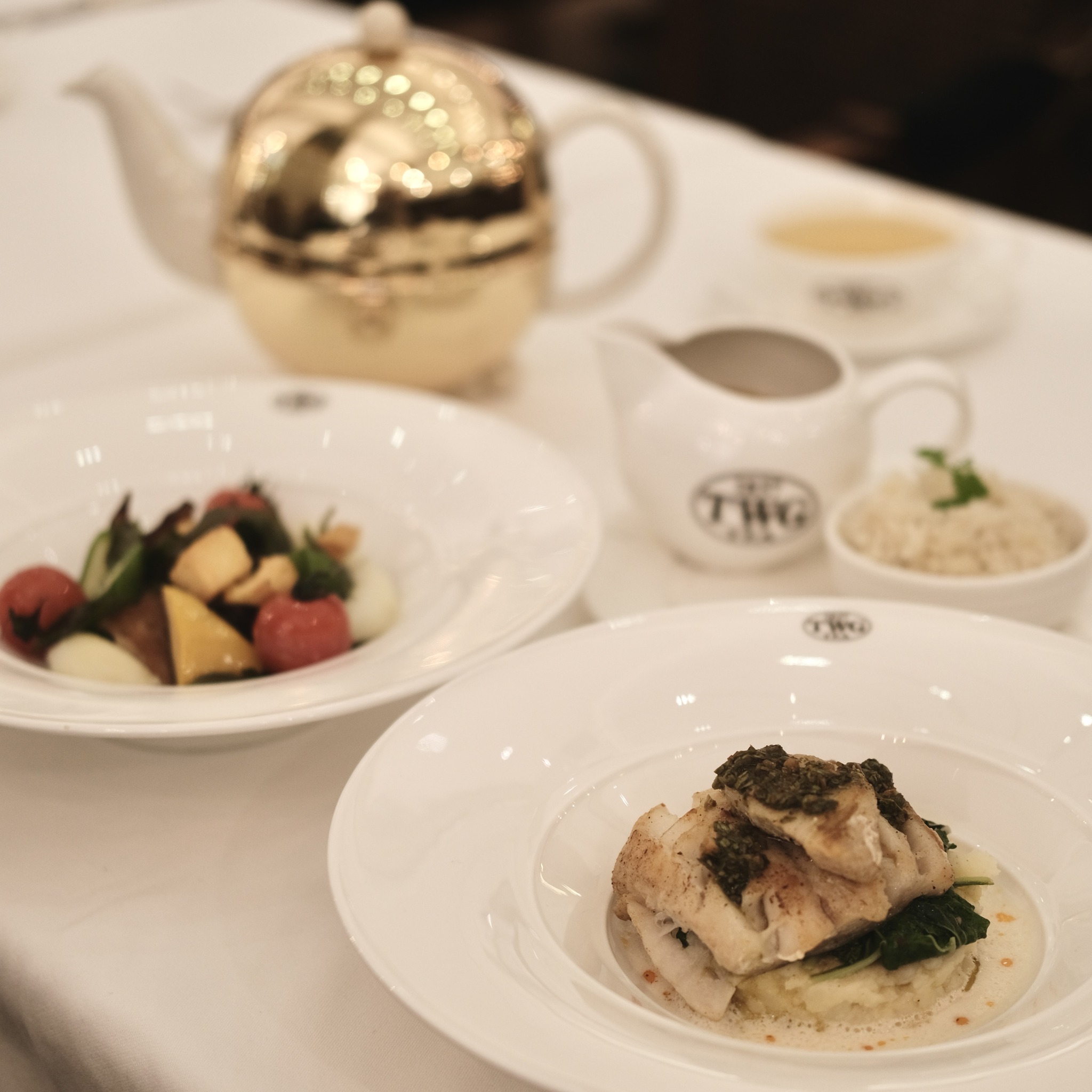 Savor the art of tea-infused gastronomy. The Roasted Barramundi 