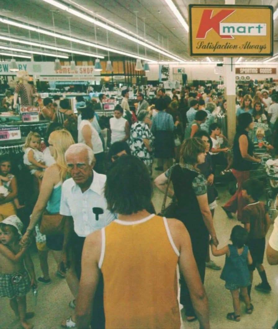 It's Saturday afternoon at Kmart, 1978. The air smells like popcorn, rubber  sandals, and cigarette smoke. Suddenly, the loudspeaker crackles:  “Attention Kmart shoppers! We are having a Blue Light Special in Aisle