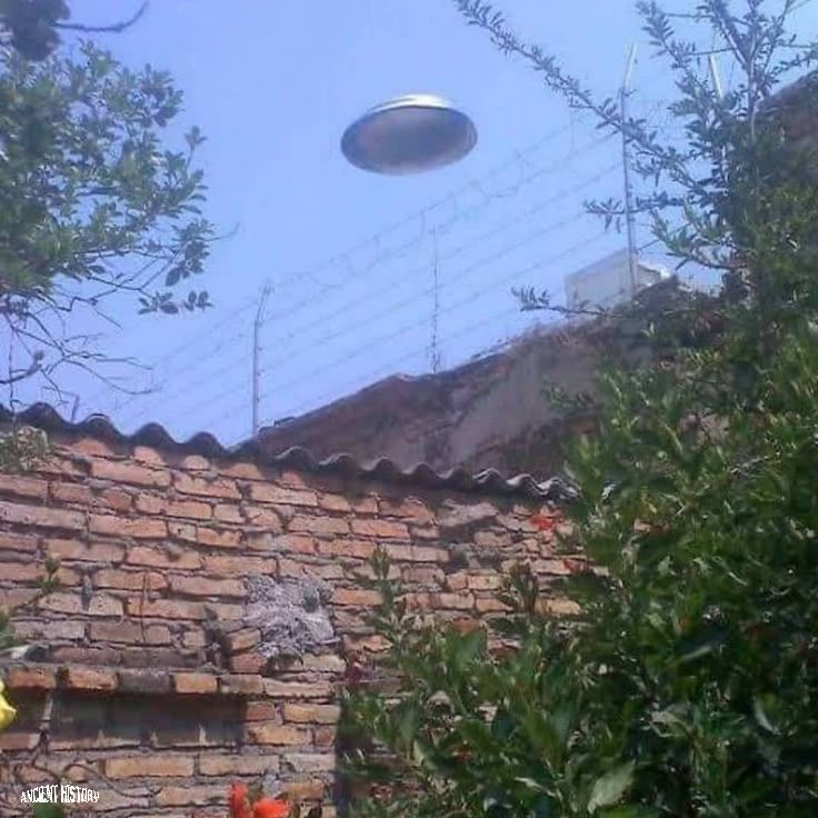 Is that a UFO or something on top or behind this building?