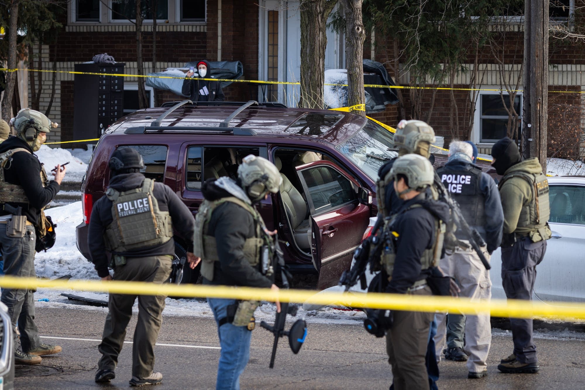 MPR - Federal agents surround a crashed vehicle on Portland Avenue in ...