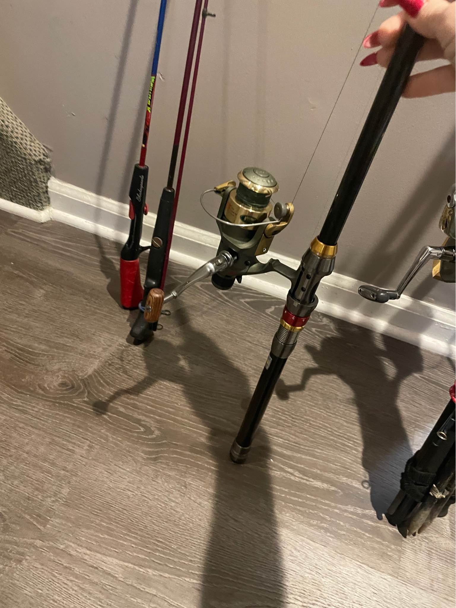 4 fishing rods with reels and two boxes of fake bait , fishing goodies ...
