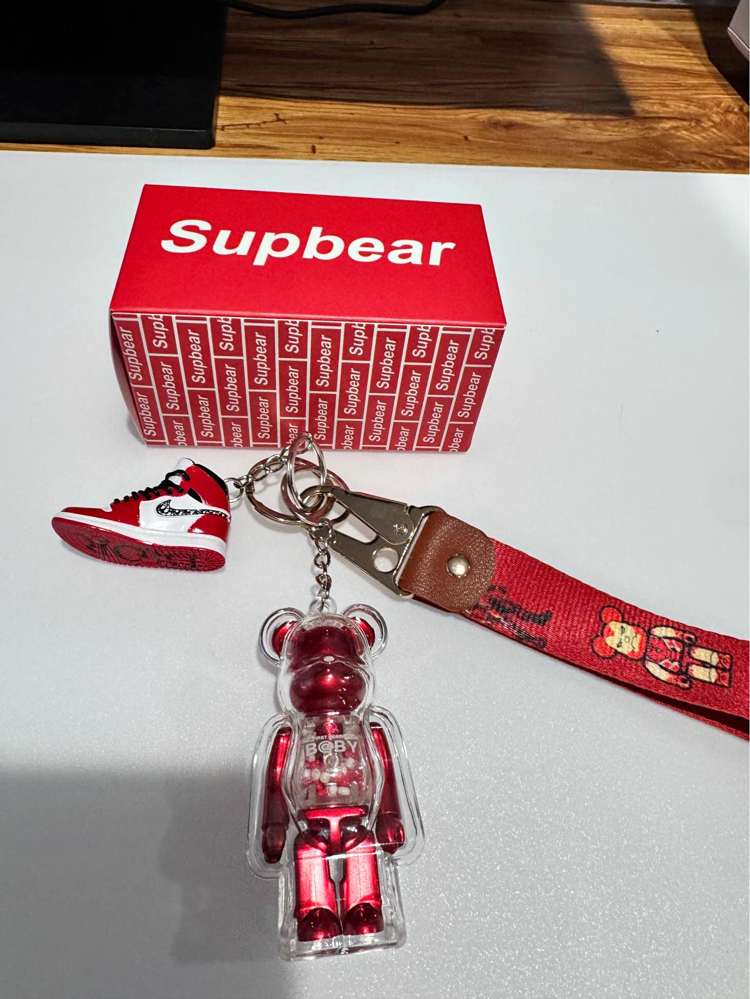 Supbear Bearbrick keychain set featuring a mini Jordan 1 Dior sneaker ...
