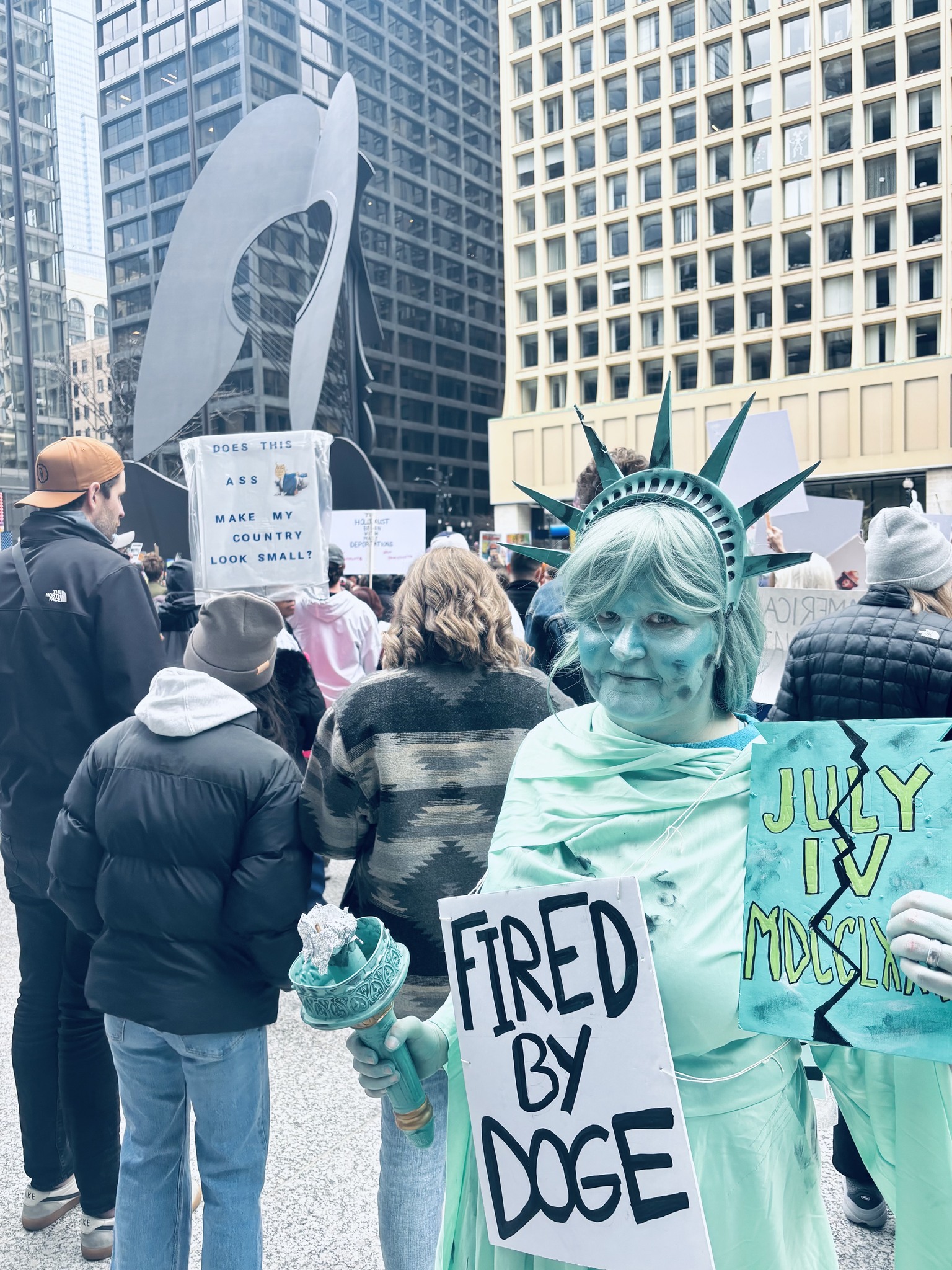 Susan - Daley Plaza, Chicago. fave sign: LET THEM EAT TESLAS | Facebook