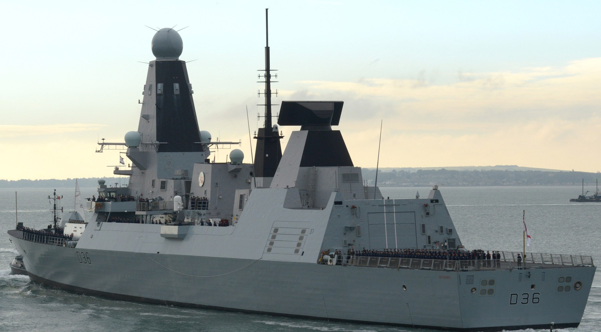 Military - HMS Defender (D36), a Type 45 destroyer, sails with its crew ...