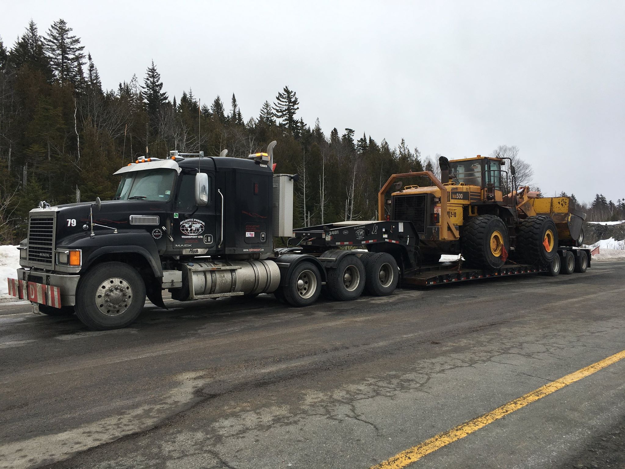 A recent Wheel Loader float... - Atlantic Pacific Transport