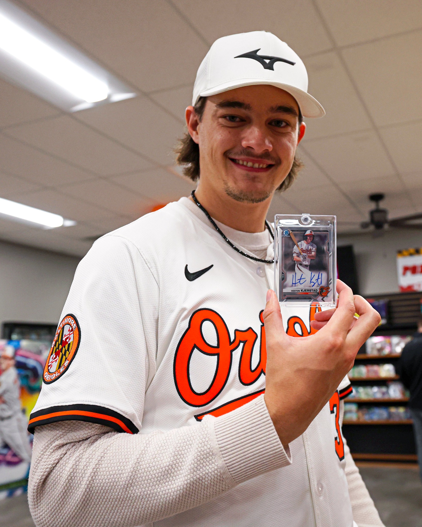 Cade Povich pulled a Heston Kjerstad Bowman Chrome autographed card