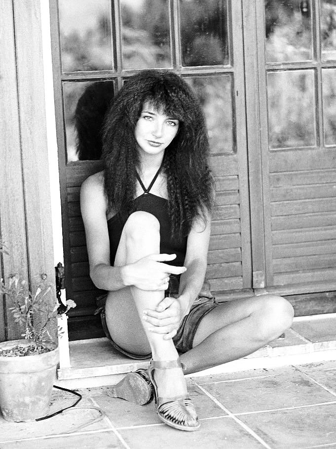 Kate Bush walking a crocodile in a parking garage, 1979 💛 Photo