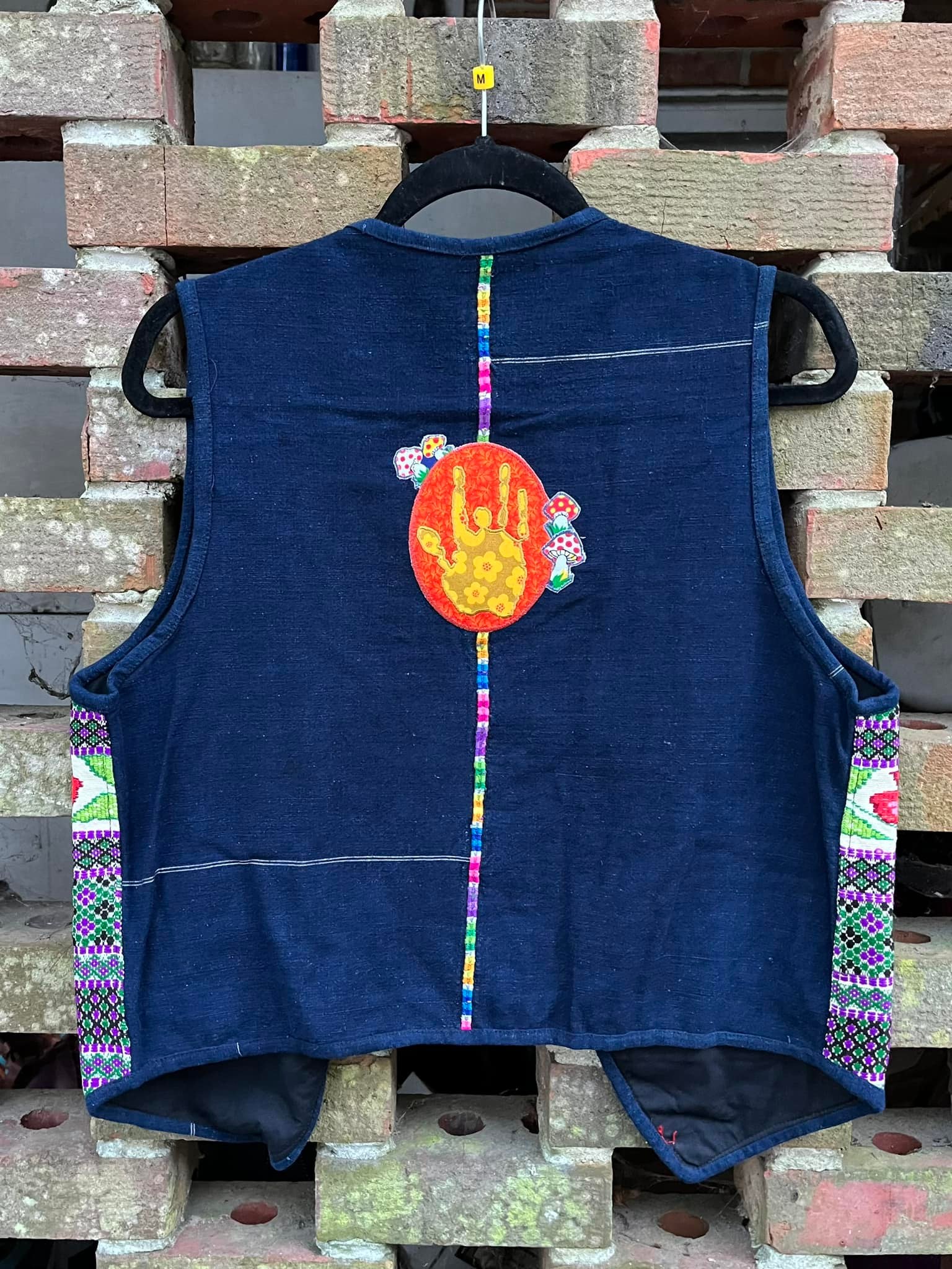 Vest with woven fabric and applique details