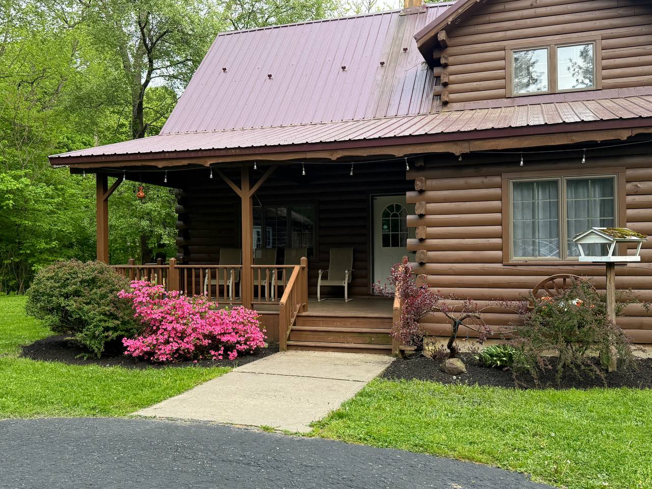 Pull in after dark and the porch is already glowing. Walk the long side ...