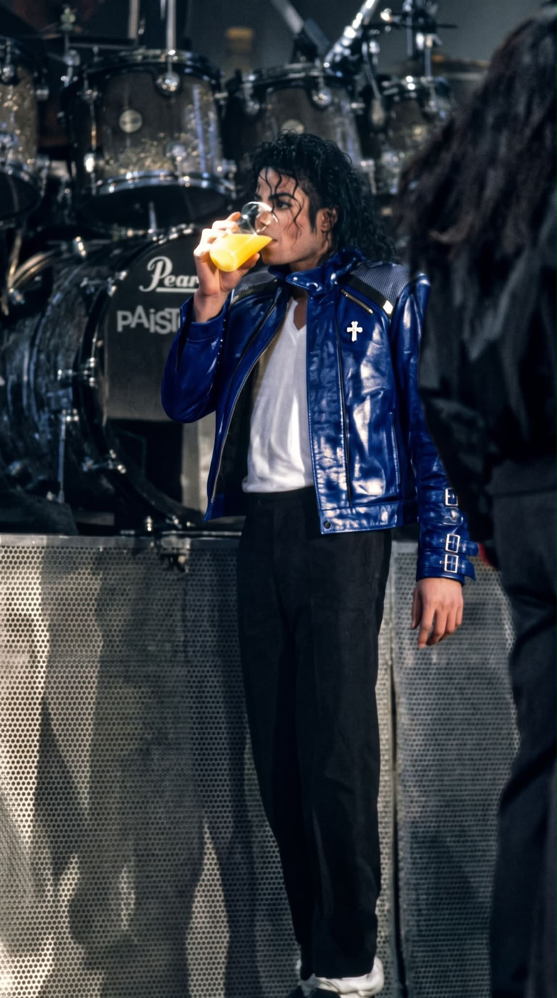 Michael Jackson takes a break on stage in leather jacket
