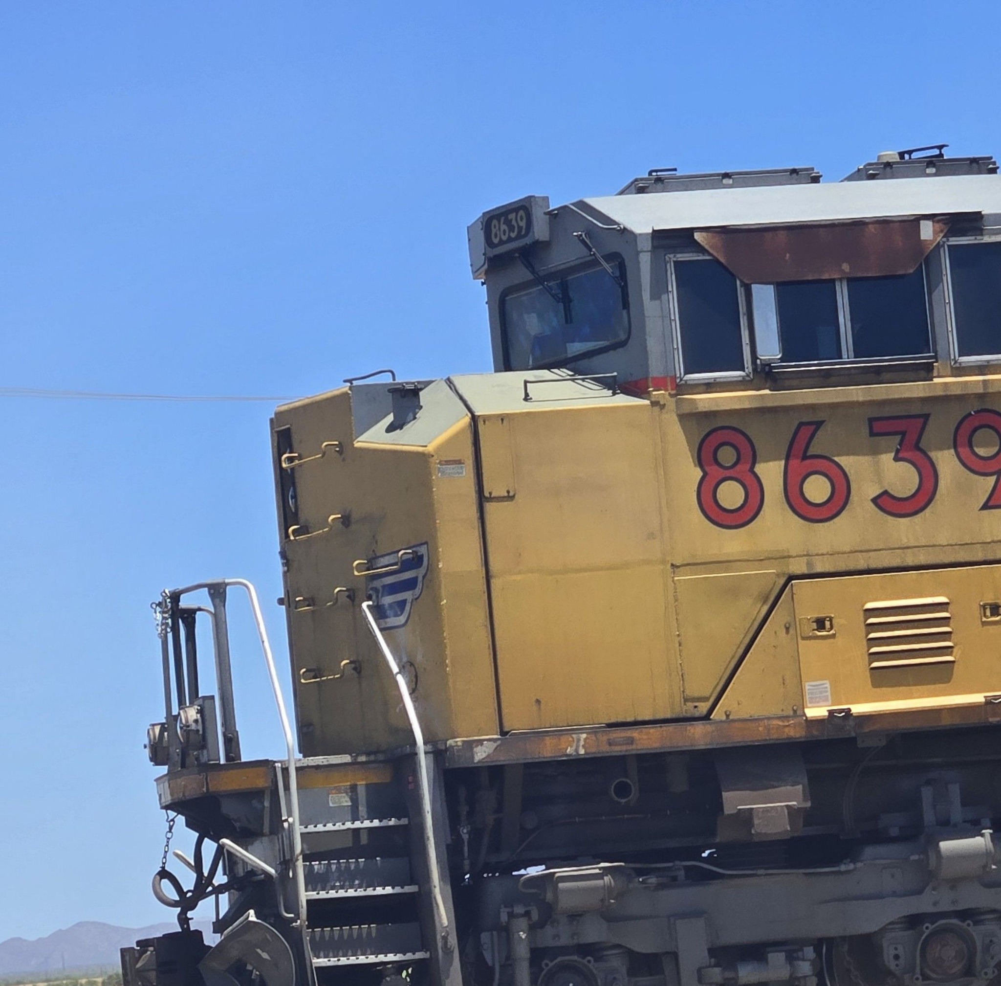 A Union Pacific AC44 speeds through the Oro Grande Aggregate carrying ...