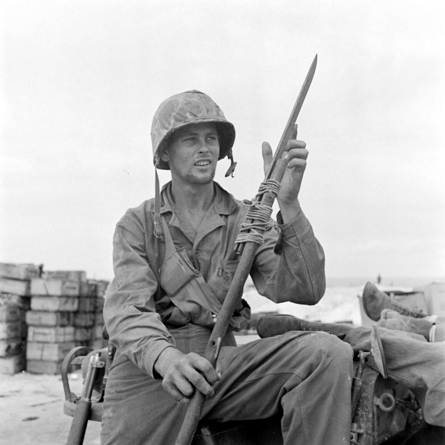 In July of 1944, a Marine inspects an improvised Japanese spear on