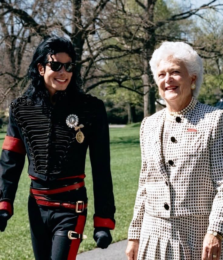 plush red leather interior of a limousine, Michael Jackson sits