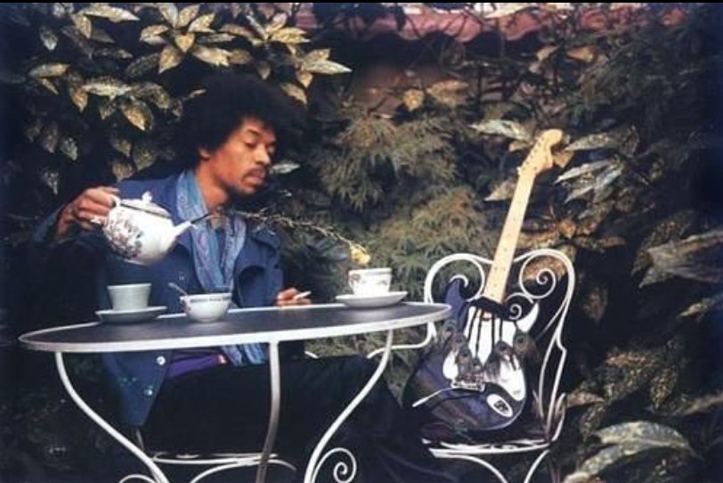 Jimi Hendrix having tea with his guitar in London, 1970