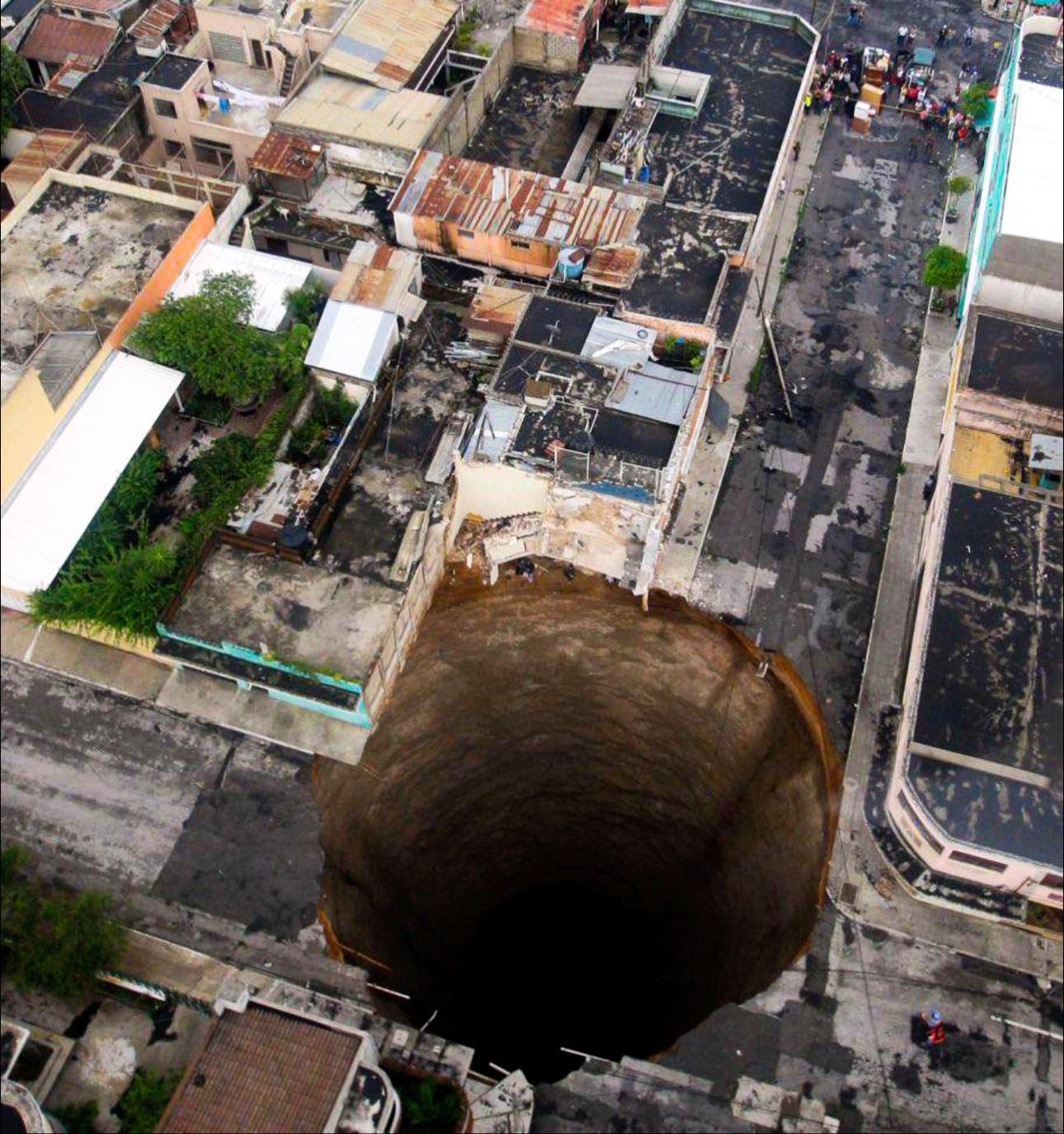 A cavernous and almost perfectly round sinkhole swallowed an